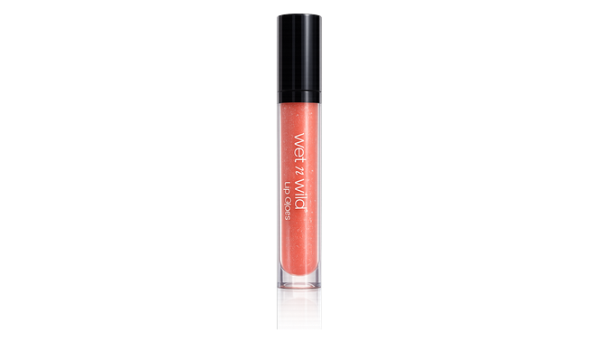 Wet and wild lip gloss lying on the sand gria